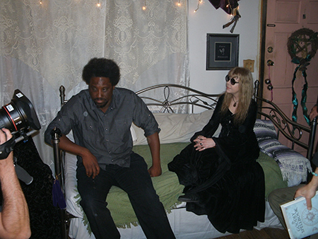 Host Kamau Bell talking with Lady Passion.