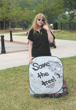 Lady Passion and "Save the Tree" sign