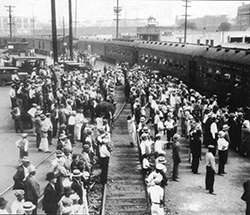 Crowd of well-dressed Mexicans waiting to board a train for deportation